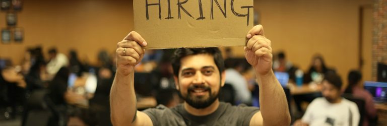 a man holding a sign